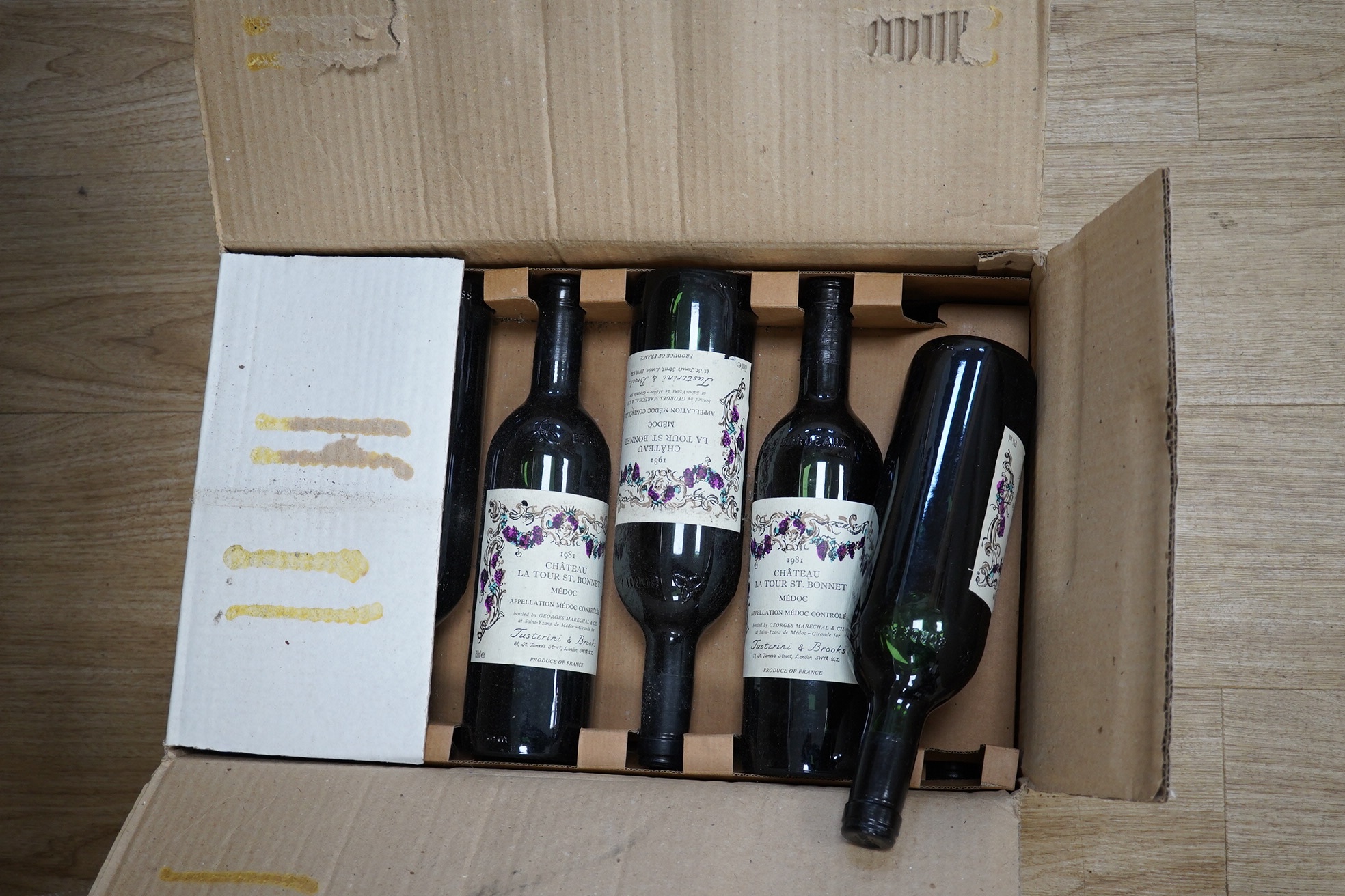 Twelve bottles of 1981 Chateau La Tour St. Bonnet Medoc red wine. Condition - fair to good, storage history unknown